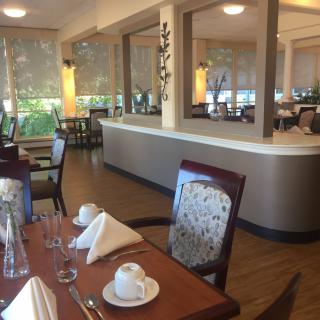 Elegant dining room with neatly set tables and stylish decor.
