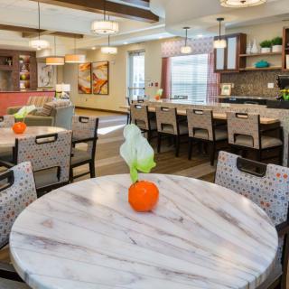 A modern dining area with stylish decor and lighting.