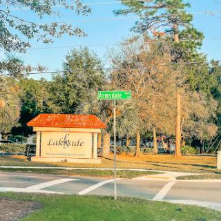 Entrance to a community named 'Lakeside' with a street sign visible.