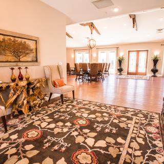 Spacious living room and dining area with elegant decor and a warm ambiance.