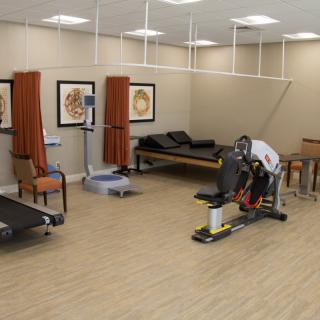 A rehabilitation center with exercise equipment and therapy spaces.