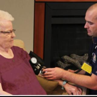 A healthcare professional measuring a patient's blood pressure.