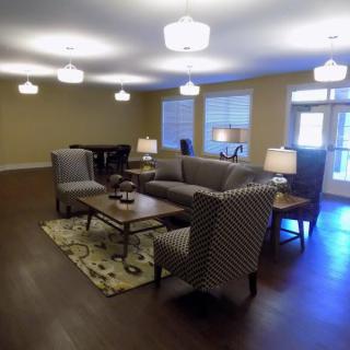 A cozy living room with comfortable seating and soft lighting.