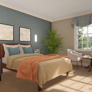 A cozy, modern bedroom featuring a comfortable bed, decorative artwork, and ample natural light.