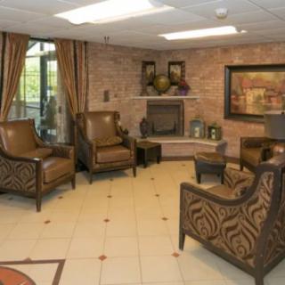 A comfortable lobby with elegant seating and a cozy fireplace.