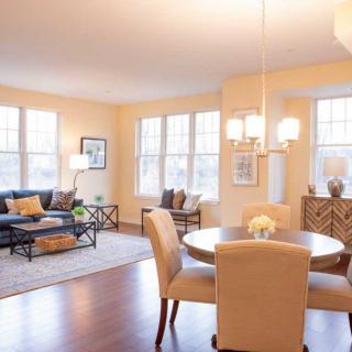 A spacious living and dining area with elegant furniture and ample natural light.