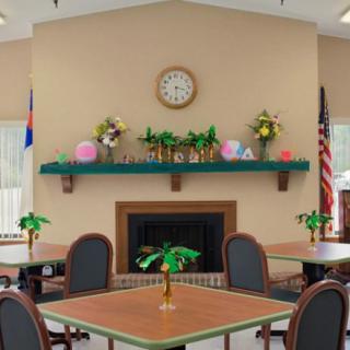 A dining area with tables and chairs, featuring a decorated fireplace with a clock above it.