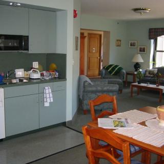 An open-plan kitchen and living area in a cozy home setting.