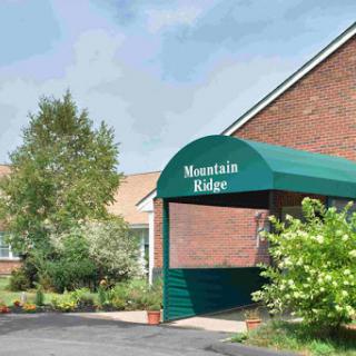 Entrance of Mountain Ridge facility with landscaped surroundings.
