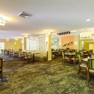 A spacious and elegantly decorated restaurant dining area.