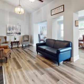 A cozy living room with stylish furniture and hardwood flooring.