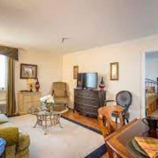 A cozy living room with comfortable seating and a TV.