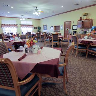 A well-arranged dining area with neatly set tables and comfortable chairs.