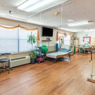 A well-lit rehabilitation therapy room designed for patient care and recovery.