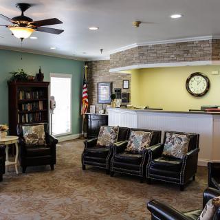 A welcoming lobby area with comfortable seating and a reception desk.