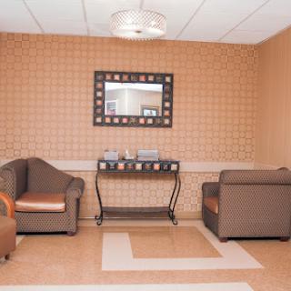 A cozy waiting area featuring comfortable seating and elegant decor.