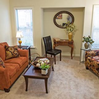 A cozy living room with elegant furniture and decor.