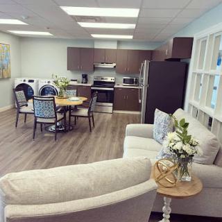 A bright and modern kitchen-dining area showcasing a cozy living space.