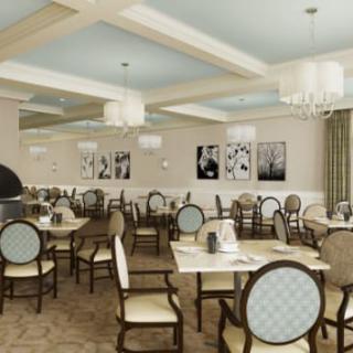 An elegant dining room with neatly arranged tables and chairs, featuring chandeliers and tasteful decor.
