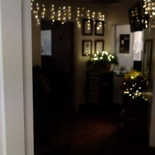 A cozy interior adorned with twinkling lights, creating a warm and inviting atmosphere.
