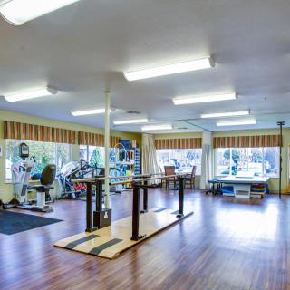 A spacious gym featuring various exercise equipment for fitness enthusiasts.