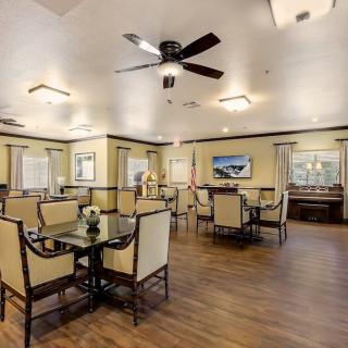 A spacious dining area with elegant decor and wood flooring.