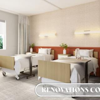 A modern hospital room with two beds and minimalist decor.