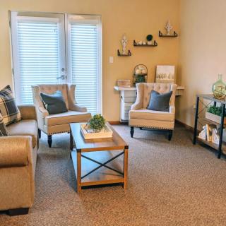 A cozy living room with comfortable seating and stylish decor.