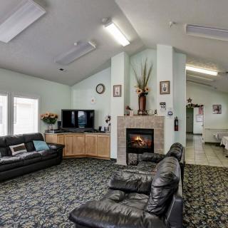 Cozy living room with fireplace and comfortable seating.