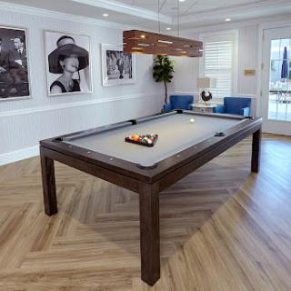 A stylish and modern recreation room featuring a pool table surrounded by elegant decor.