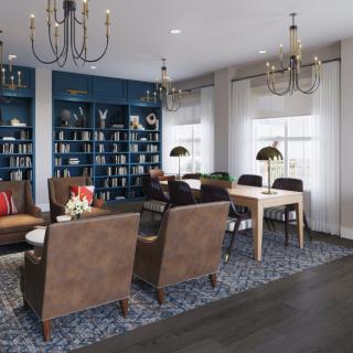 A stylish living room with chandeliers, bookshelves, and comfortable seating.