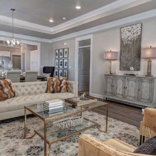 A beautifully decorated living room with elegant furniture and soft lighting.