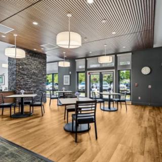 A modern dining area with sleek furniture and contemporary lighting.