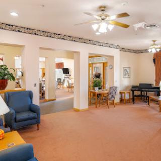 A cozy lounge area featuring comfortable seating and warm decor.