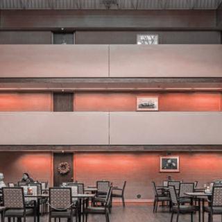 A modern dining area with stylish furniture and ambient lighting.
