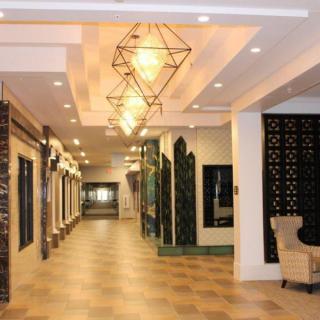 A modern hallway with distinctive lighting fixtures and elegant interior design.