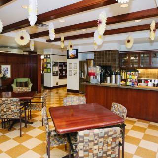 Cozy cafe interior with seating and decor.