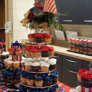 A festive display of cupcakes decorated in red, white, and blue for a patriotic celebration.