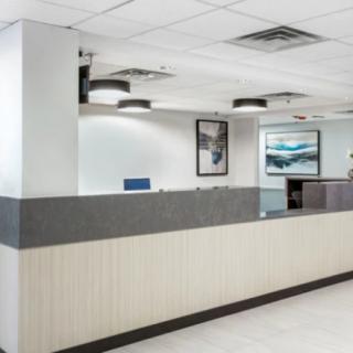 A modern reception desk in an office setting.