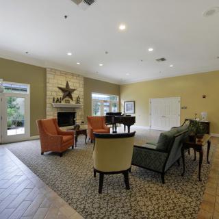 A cozy living room with a seating area and fireplace.