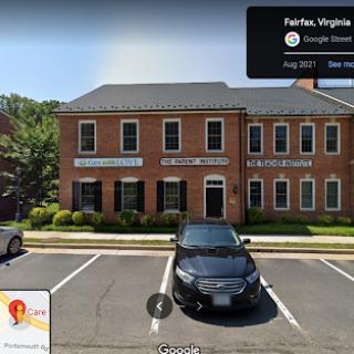 A commercial brick building with multiple office spaces located in Fairfax, Virginia.