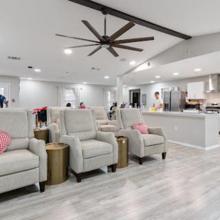 A stylish and inviting living room featuring modern recliners and an open floor plan.