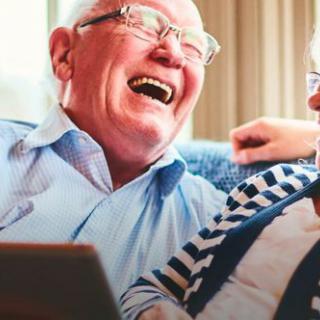 Elderly couple enjoying a joyful moment together.