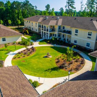 Aerial view of a residential complex with a landscaped courtyard.