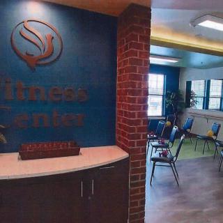 A reception area with a waiting room setup, featuring chairs and office decor.