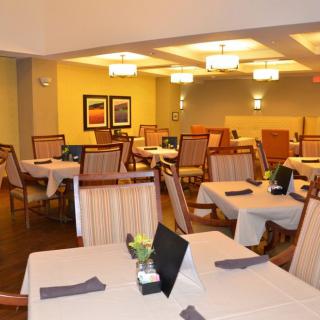 A cozy restaurant dining area with neatly arranged tables and chairs.