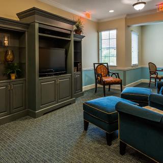 A cozy living room with comfortable seating and a television.