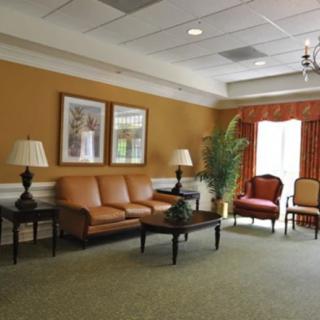 A cozy living room with sofas, chairs, and a coffee table.