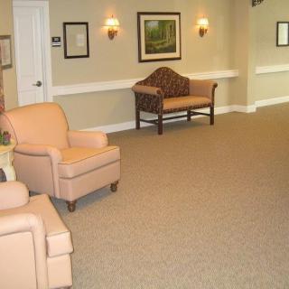 A cozy lobby with comfortable seating and warm lighting.