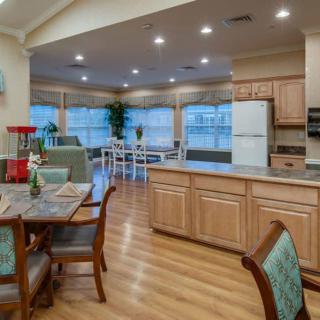 A spacious open-plan kitchen and dining area with modern decor and wooden flooring.